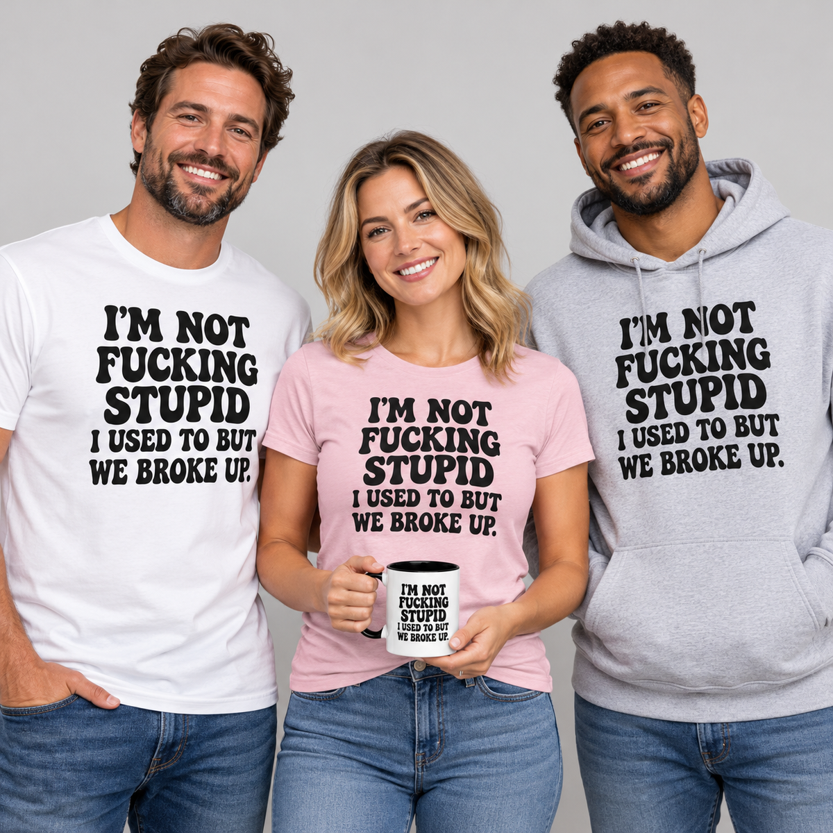 Adults wearing I'm Not Fucking Stupid We Broke Up graphic T-shirts and hoodie with a matching breakup humor mug